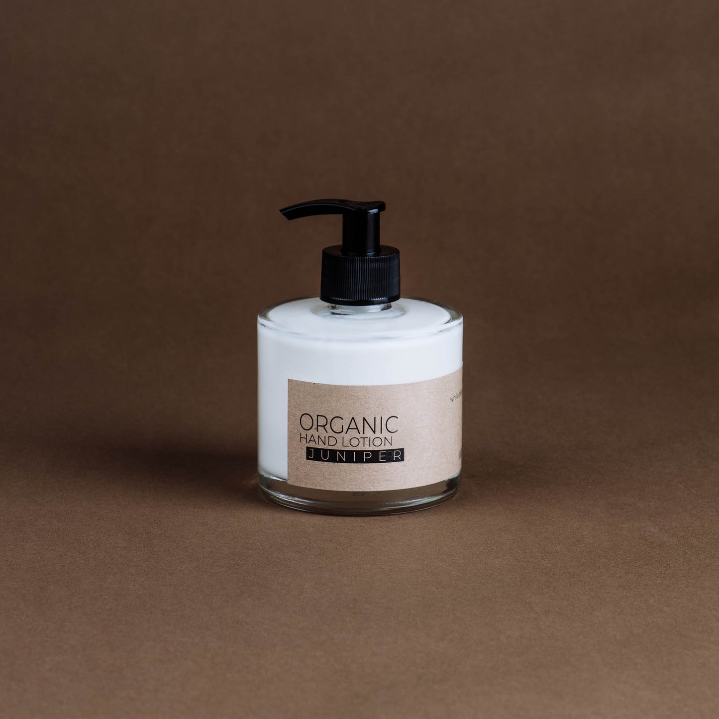 Juniper organic hand lotion in glass bottle