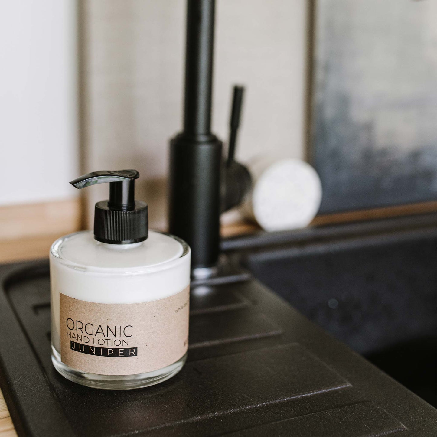 Juniper organic hand lotion in glass bottle